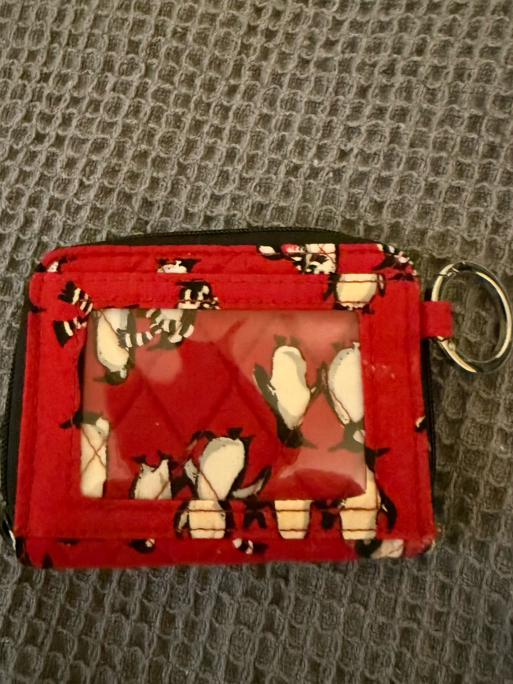 Vera Bradley Penguin print card holder with external ID slot.